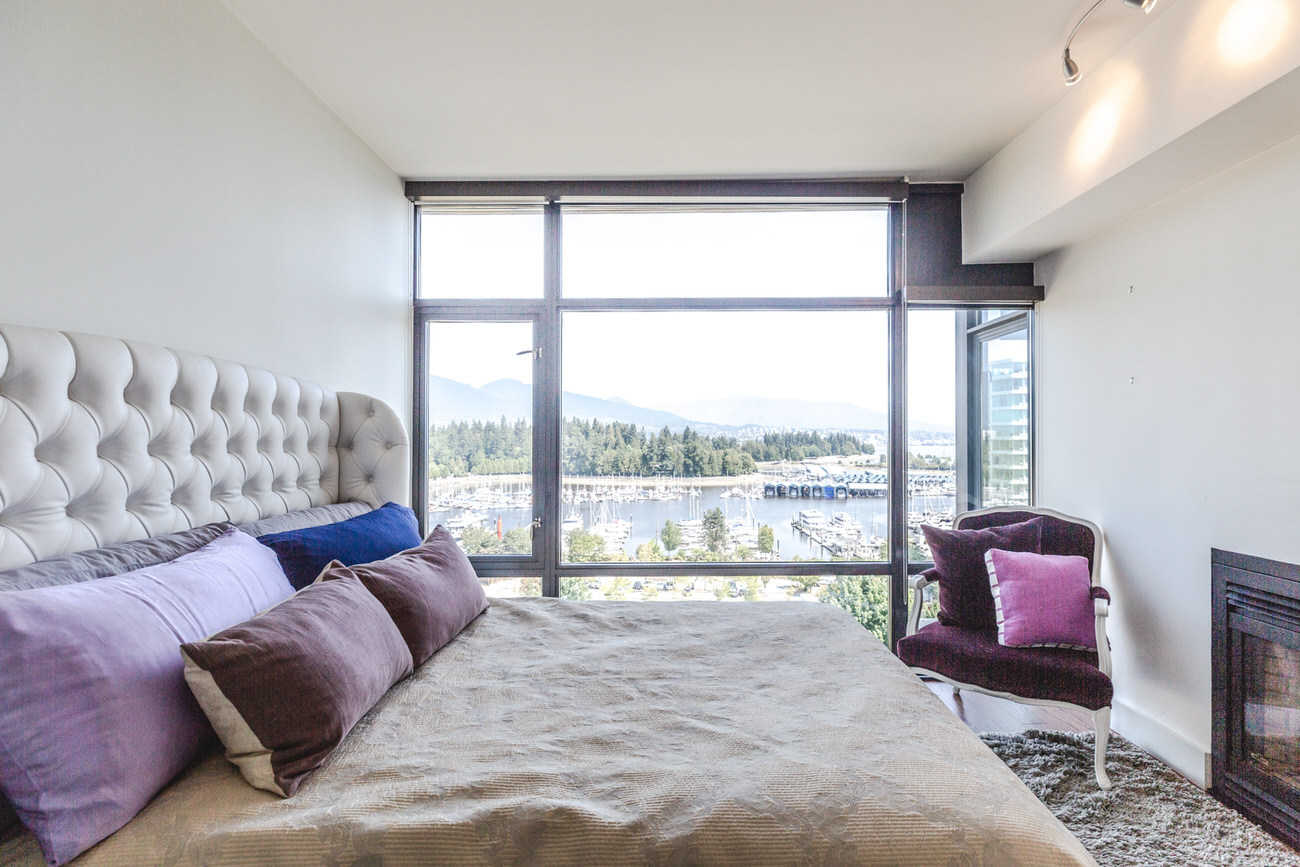 Furnished bedroom in Downtown Vancouver condo with view.
