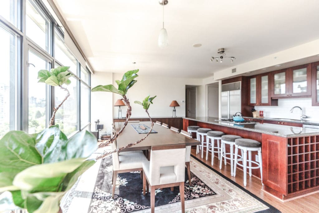 Open concept dining area of Vancouver rental condo with view.