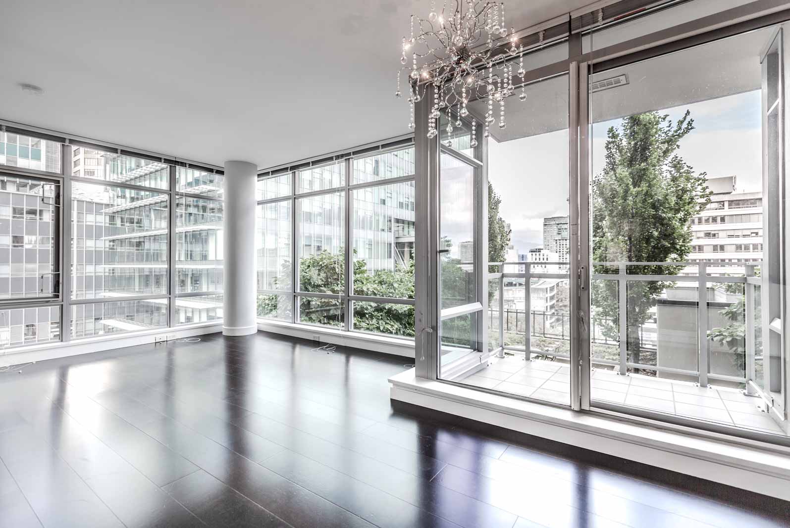 Bright Living Room With Dark Hardwood in Vancouver Rental Condo at L'Hermitage