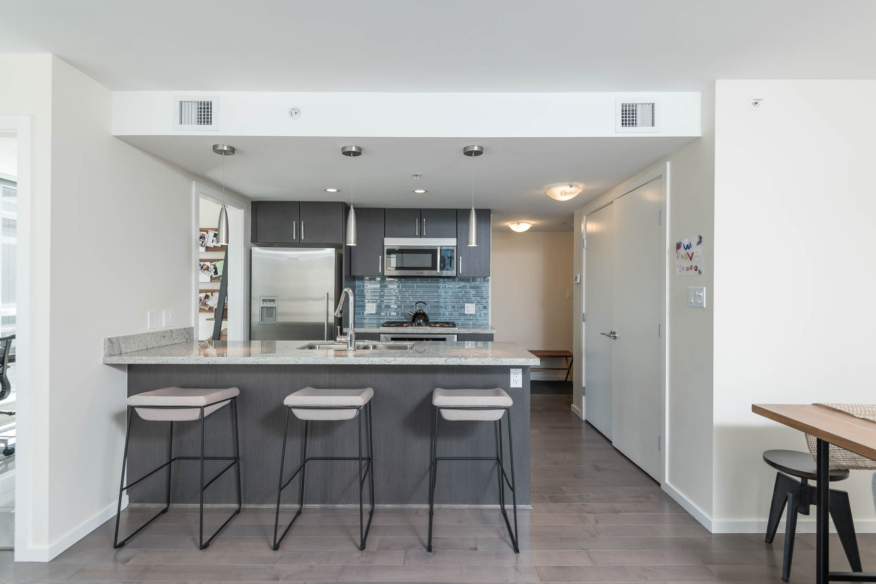 Furnished kitchen and dining area inside Vancouver rental condo.