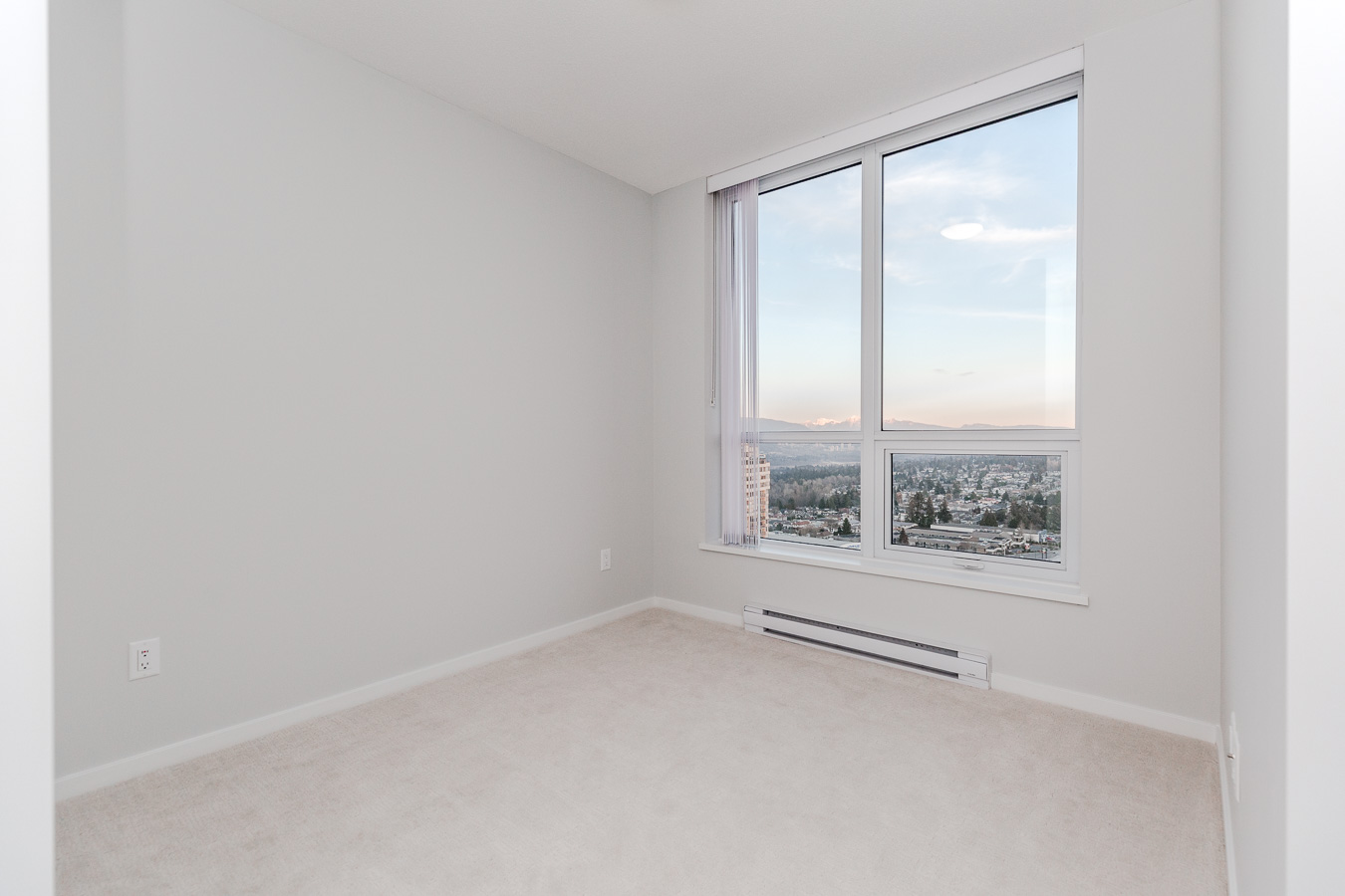 Bedroom with a view in Metrotown condo managed by Birds Nest Properties.