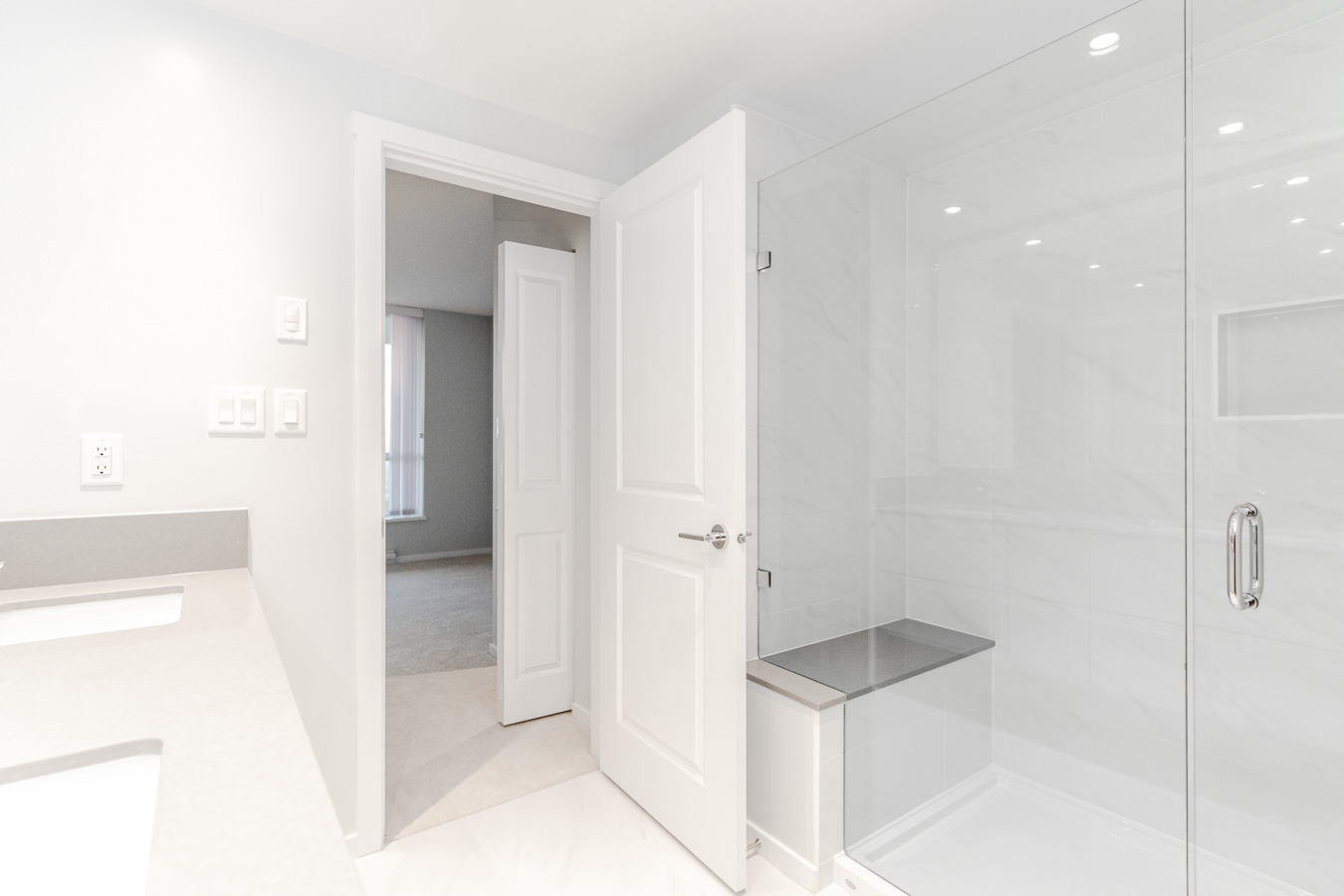 Bathroom with walk-in shower at Metrotown rental condo.