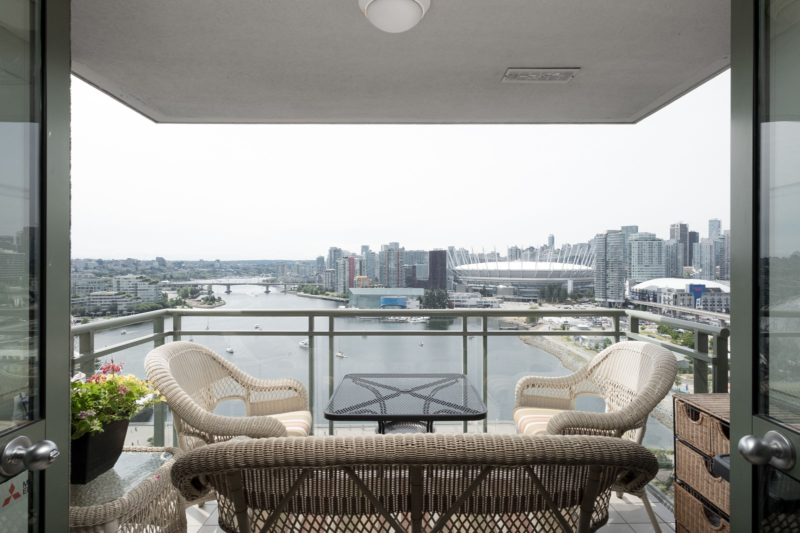 Private balcony of furnished Vancouver rental overlooking waterfront.