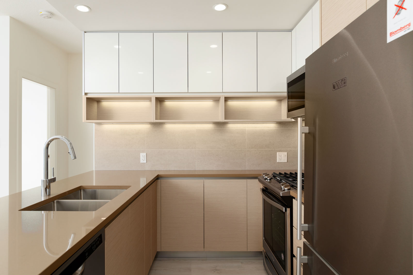 Kitchen with stainless steel appliances in Burnaby Mountain rental condo.
