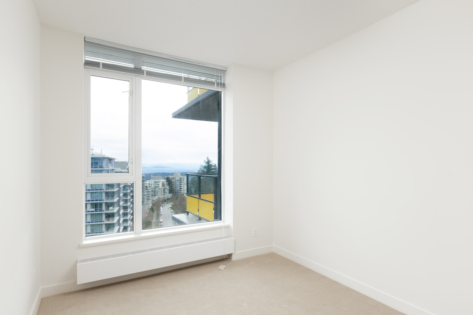 Bedroom with view at Burnaby Mountain condo rental managed by Birds Nest Properties.