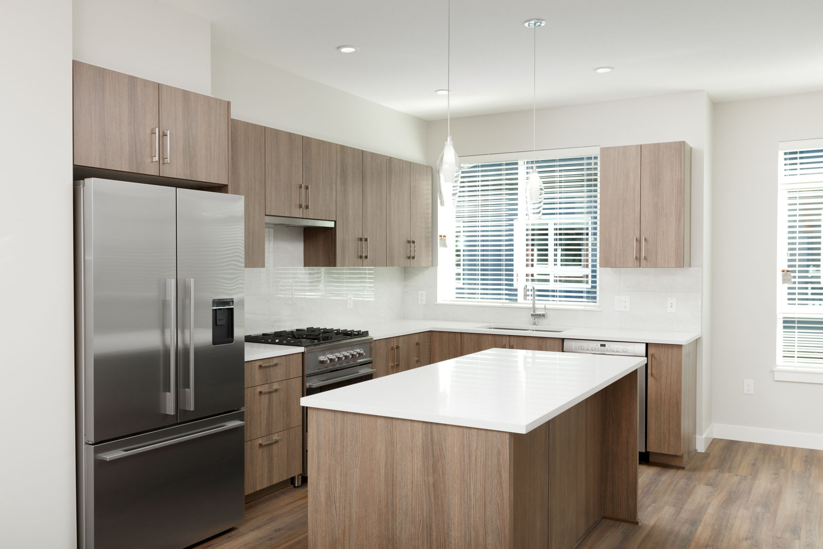 Kitchen with stainless steel appliances in luxury Richmond rental townhome.