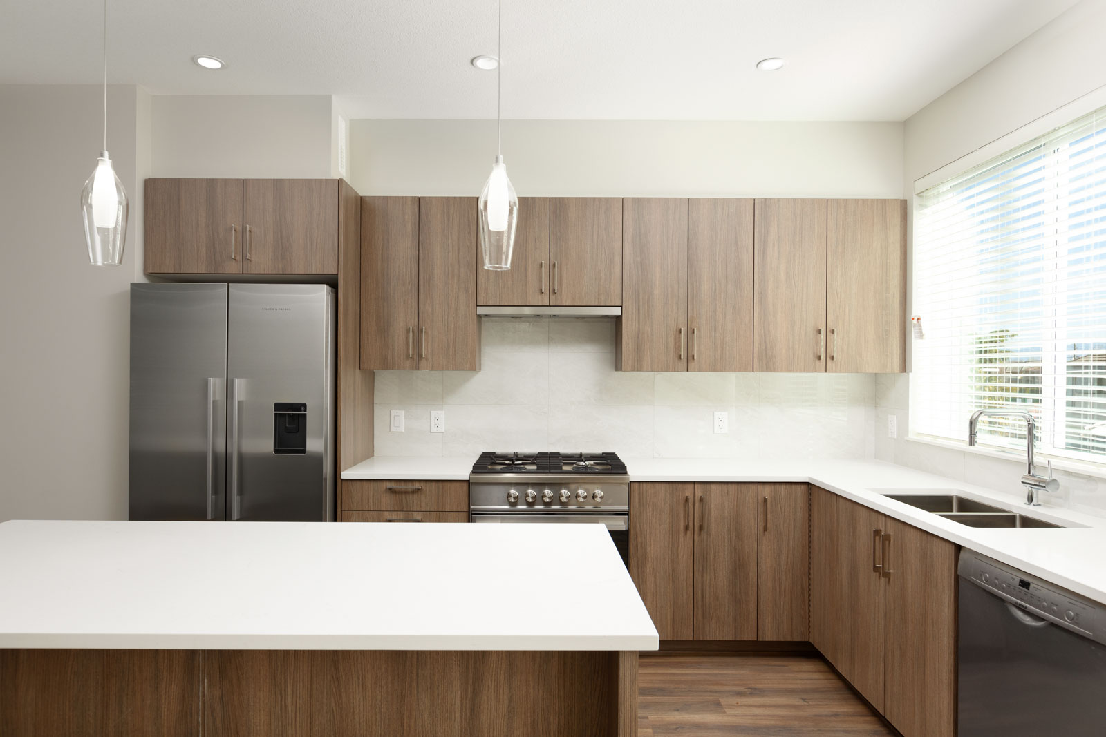 Newly renovated kitchen with butternut wood cabinetry in Richmond luxury rental townhome.