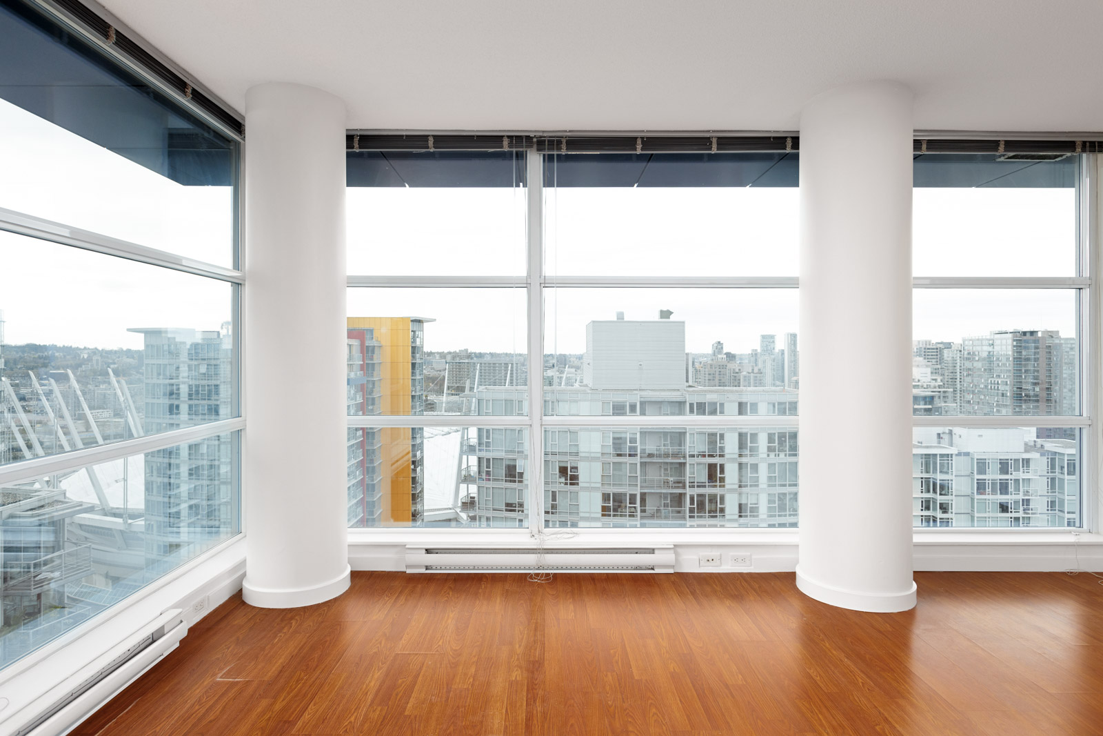 Living area with pillars of Downtown Vancouver luxury condo with view.