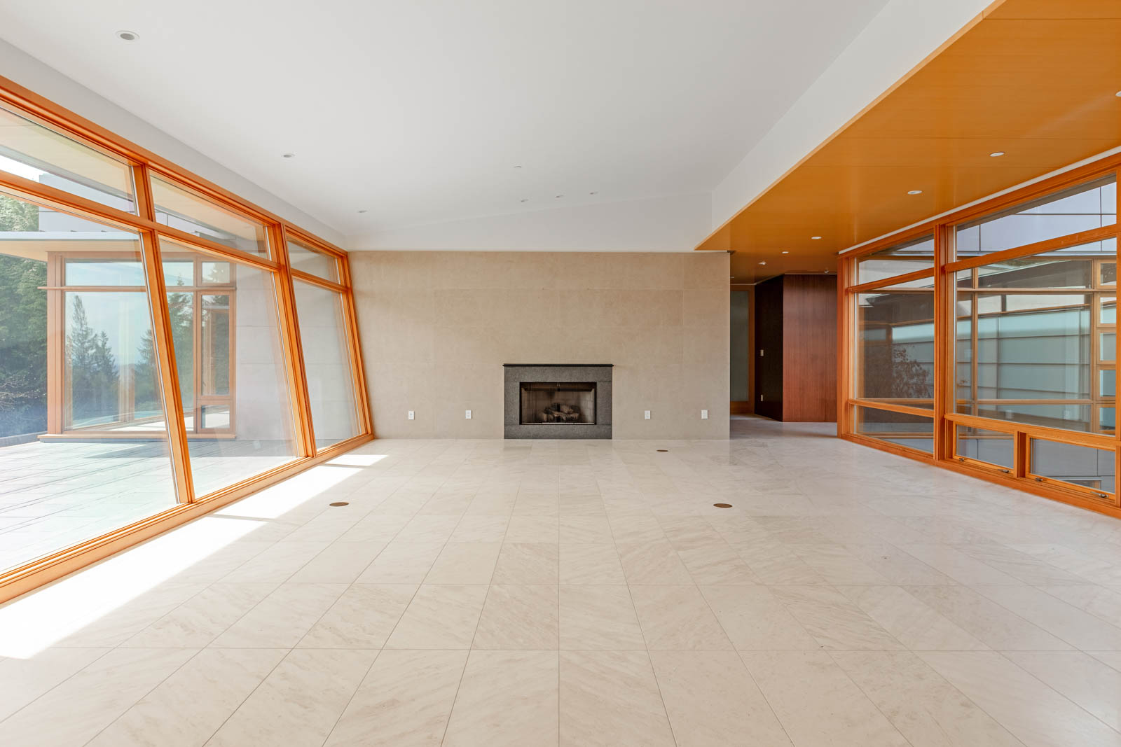 Living area and fireplace inside West Vancouver luxury rental home.