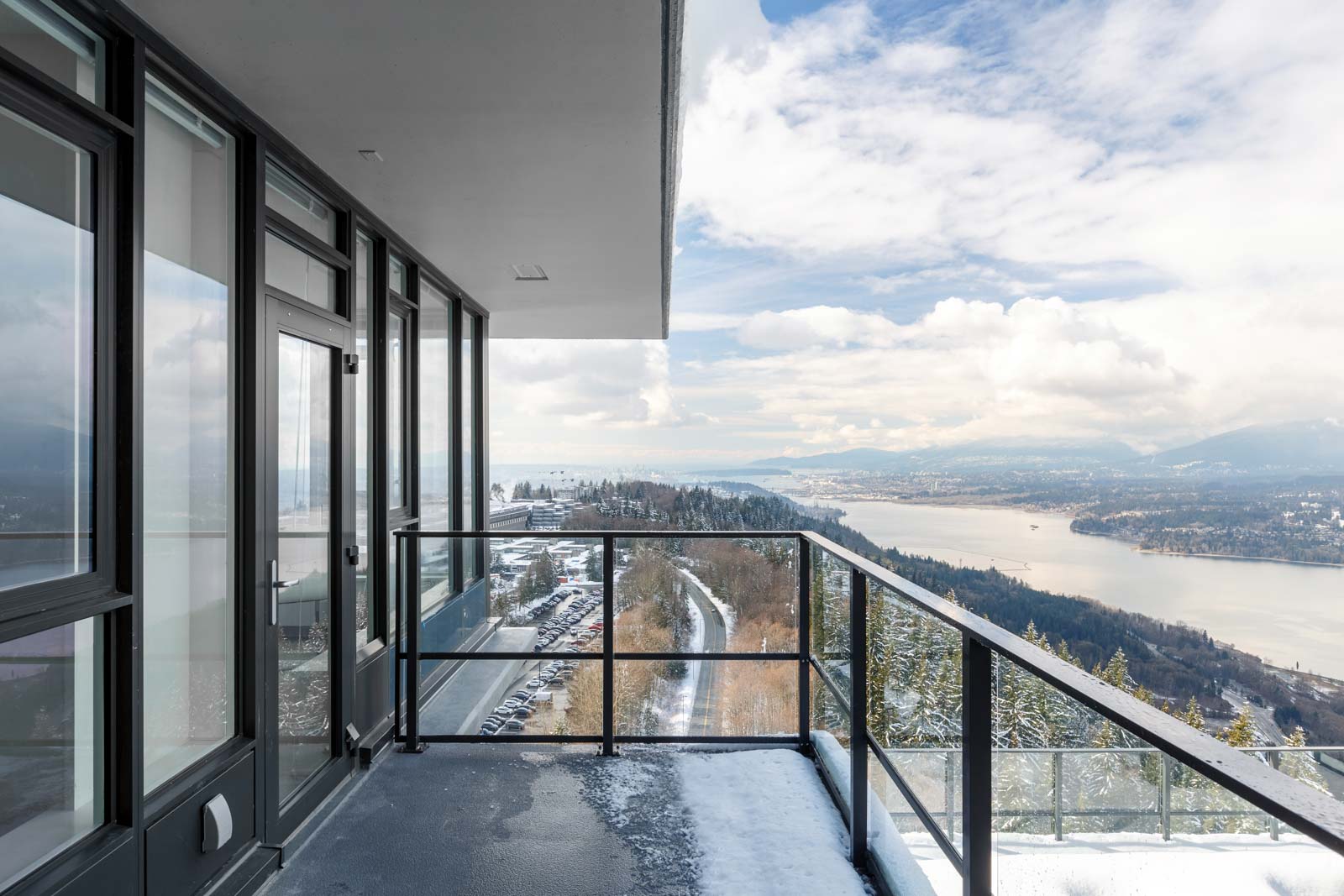 Waterfront view from private balcony of Burnaby Mountain luxury rental penthouse.