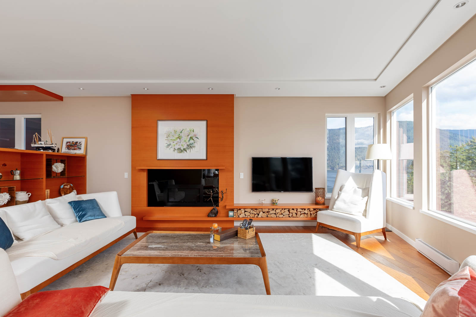 Living room with fireplace inside North Vancouver luxury rental home.