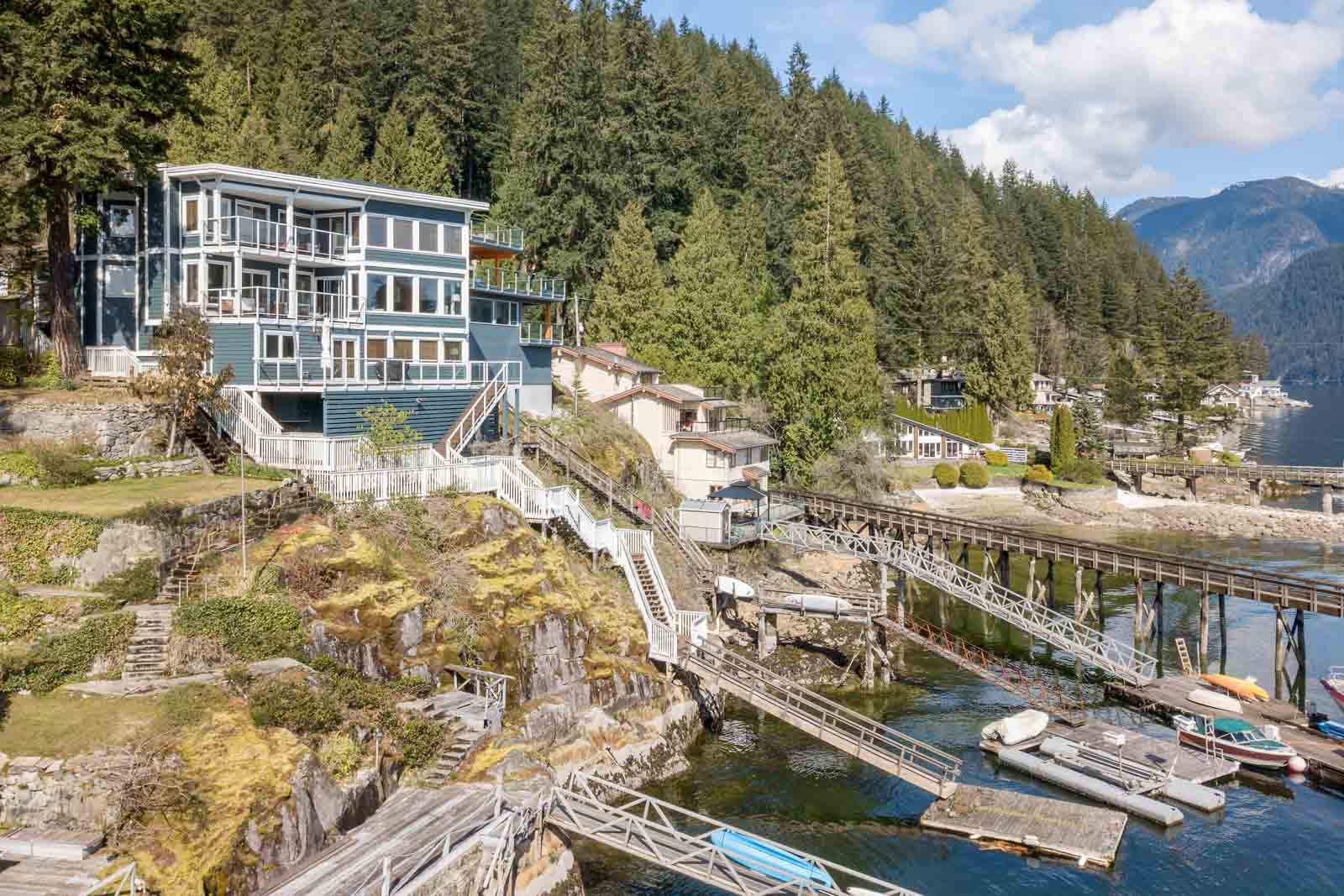 Cliffside view of private deck and waterfront of North Vancouver luxury rental home.