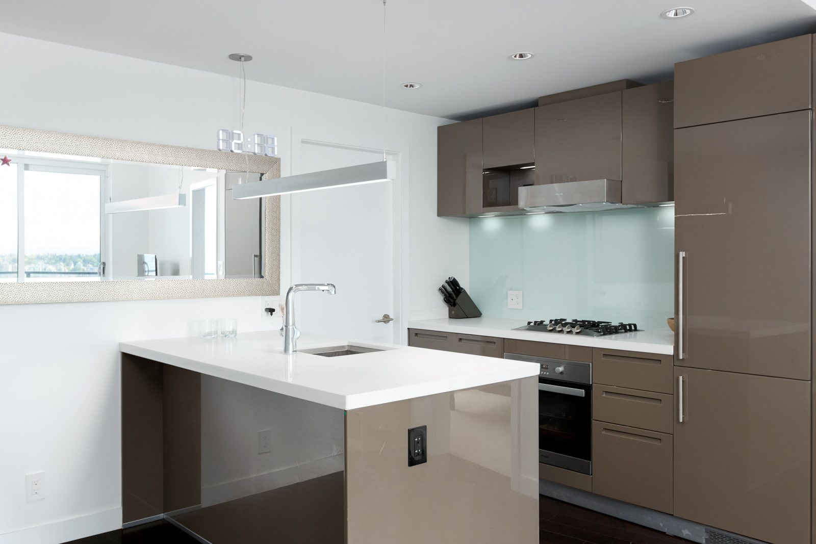 Furnished kitchen in Downtown Vancouver condo with stainless steel appliances.