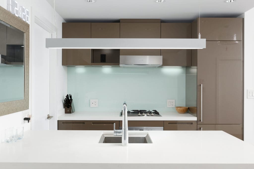 Newly renovated kitchen with stainless steel appliances in Downtown Vancouver condo.
