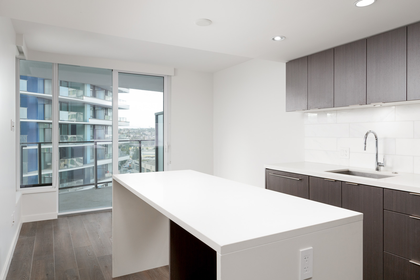 White kitchen island in luxury Vancouver condo.