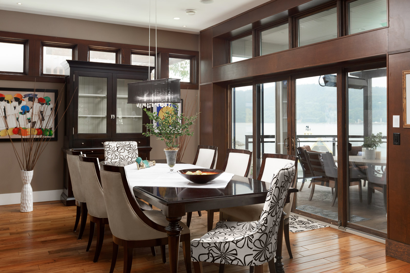 Dining room with waterfront view of Vancouver's North Shore.