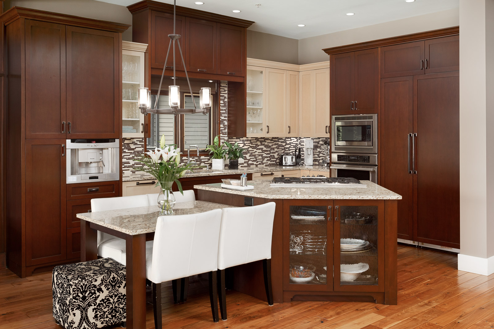 Kitchen with mahogany cabinetry inside North Vancouver luxury rental home.