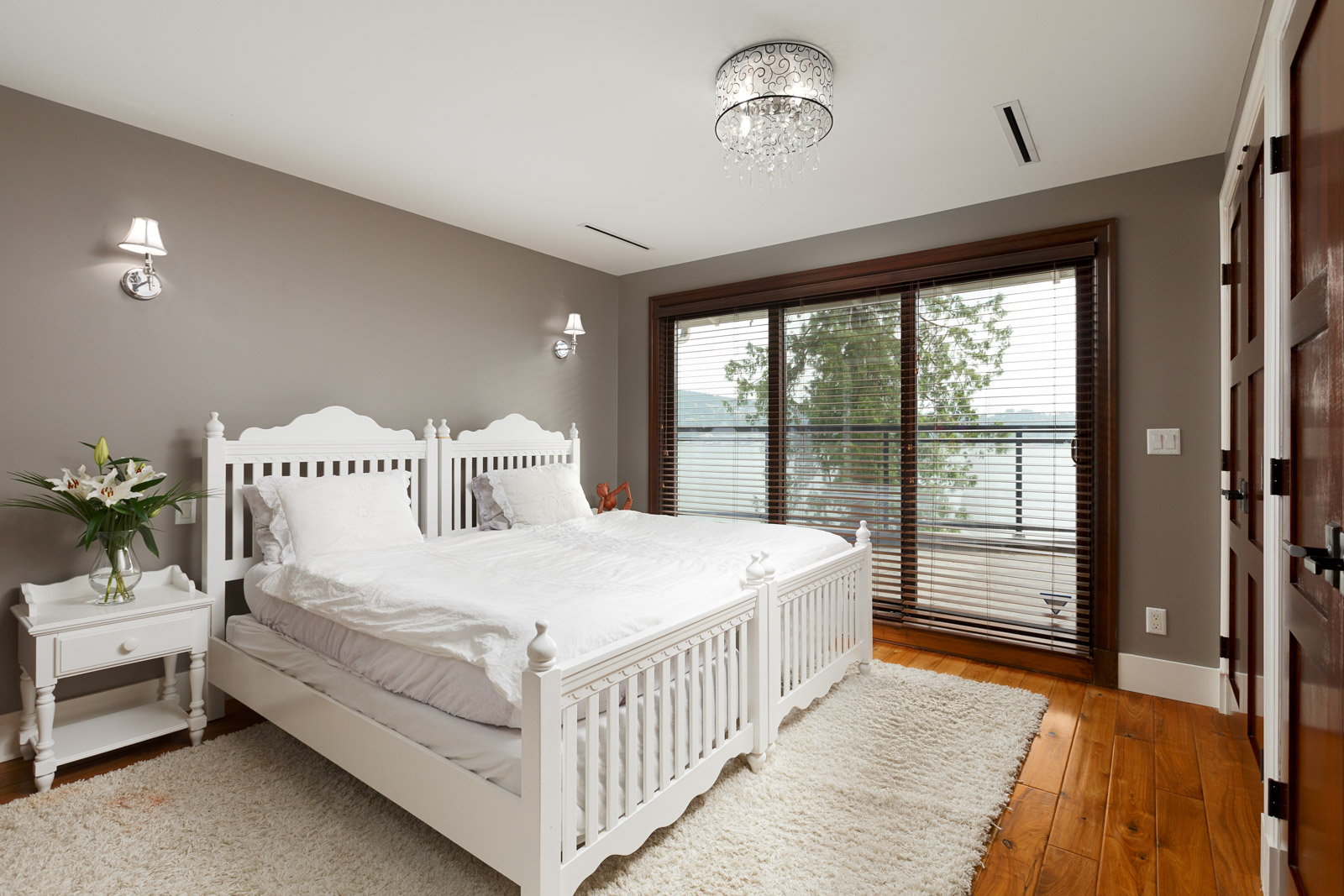 Bedroom inside North Vancouver luxury rental with waterfront view.