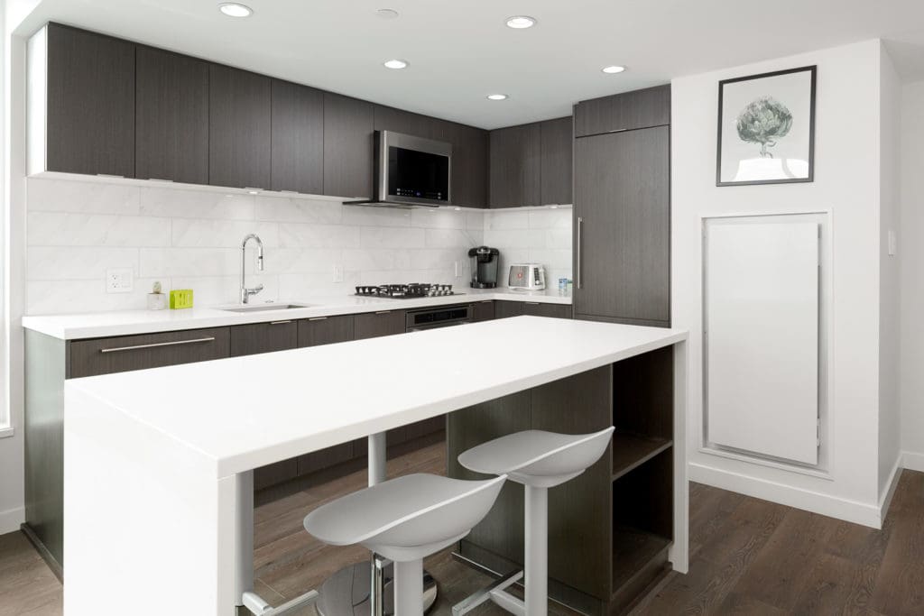 Kitchen with sit-down bar in Vancouver luxury rental.