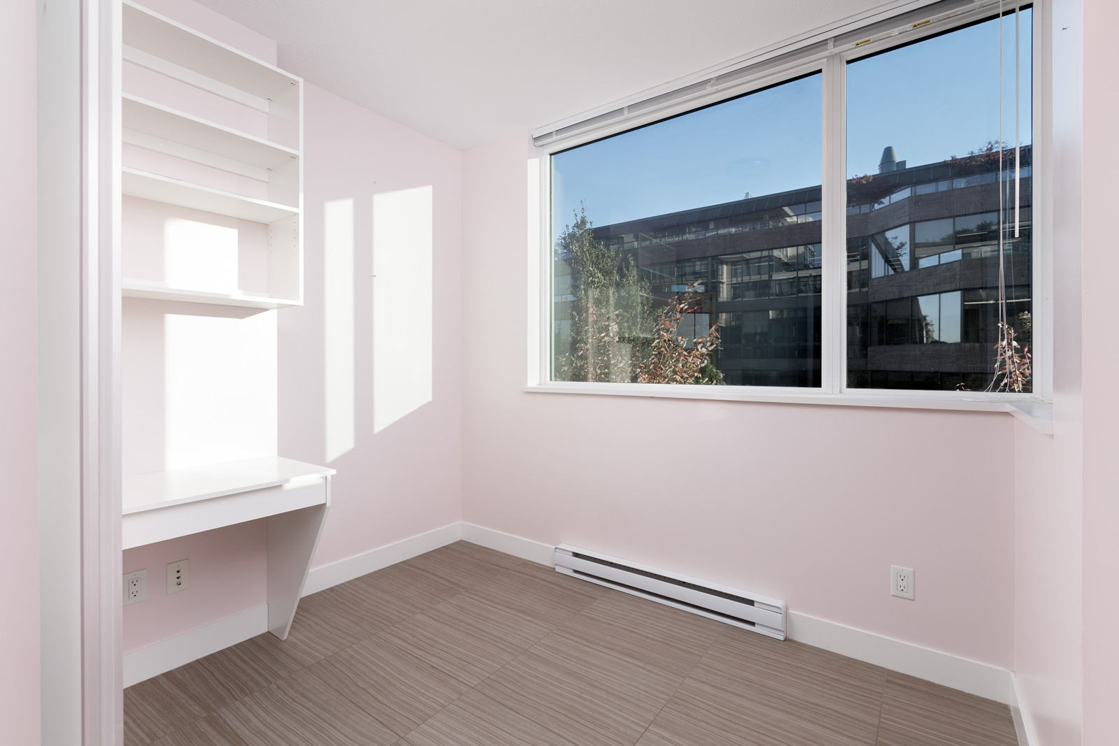 Bedroom with sunlight coming in from window in Kits360 condo rental