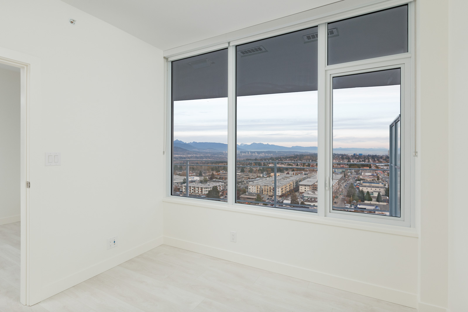 windows from bedroom with white walls of burnaby metrotown condo