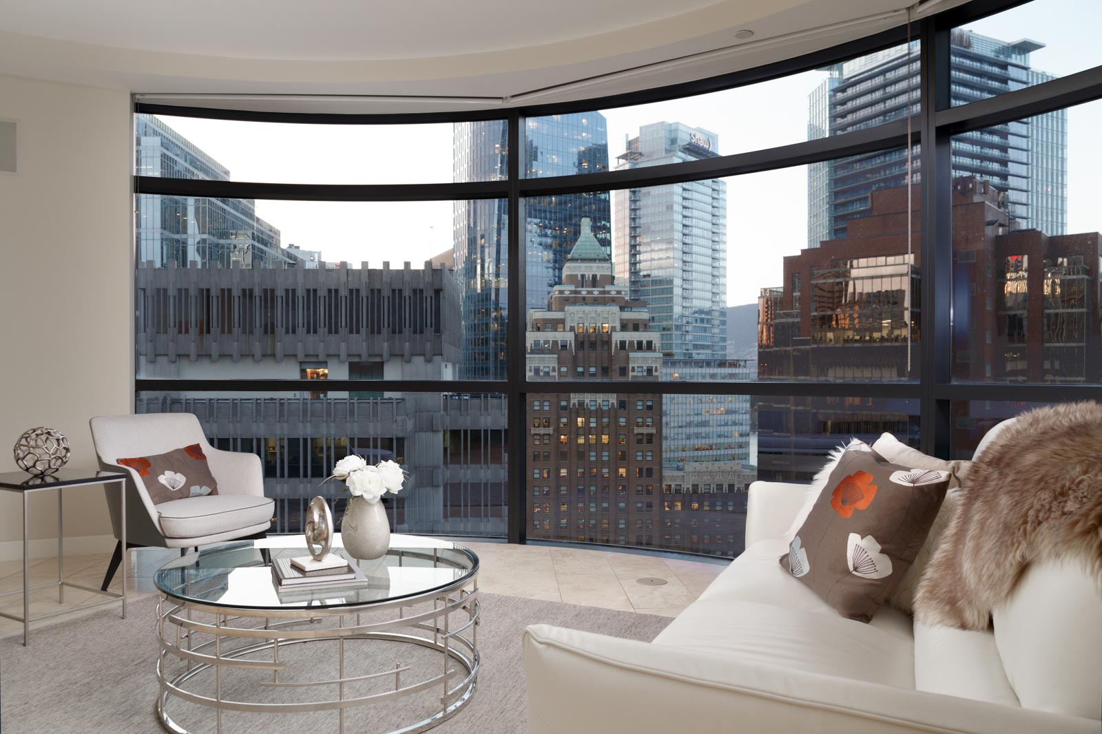living room from jameson house condo with full window views of downtown vancouver