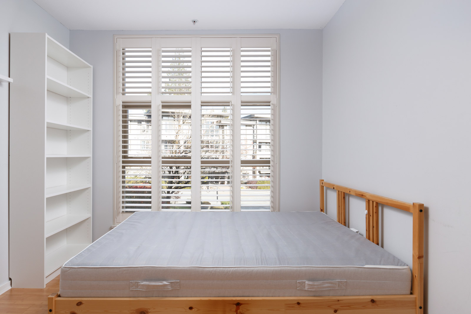 bedroom with windows and bed and mattress in burnaby condo for rent