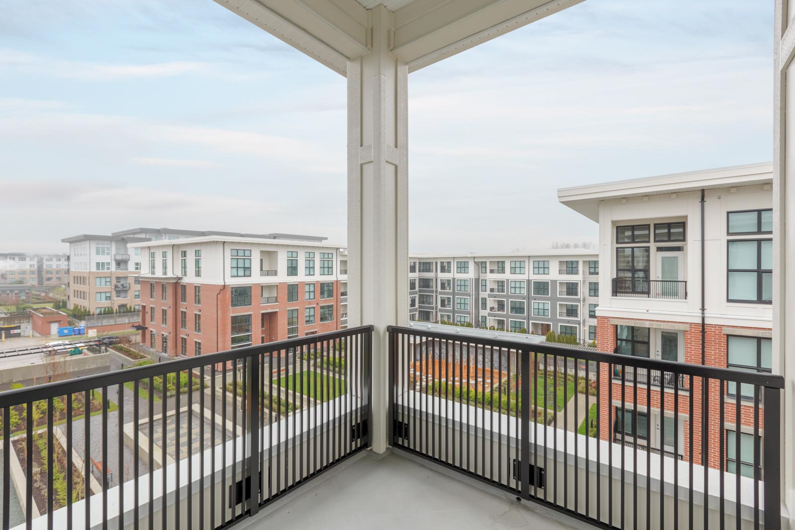 corner balcony patio of richmond rental townhouse unit overlooking multi family apartment building