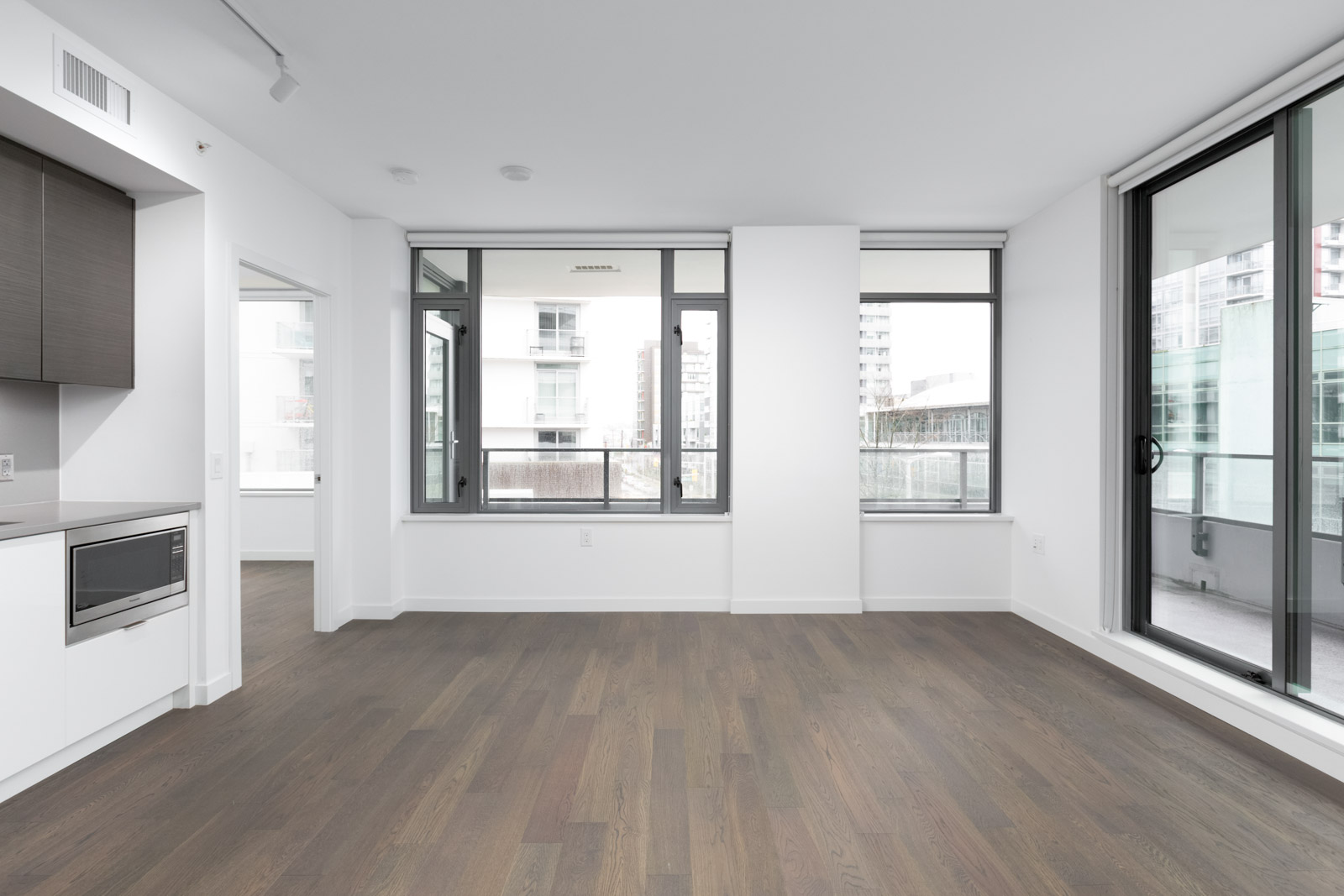 empty living room in olympic village vancouver condo rental managed by birds nest properties