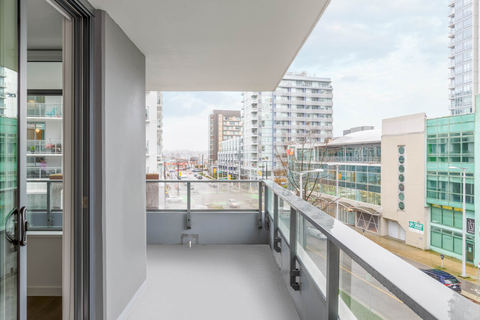 wraparound balcony overlooking olympic village vancouver from leed gold navio south condo building