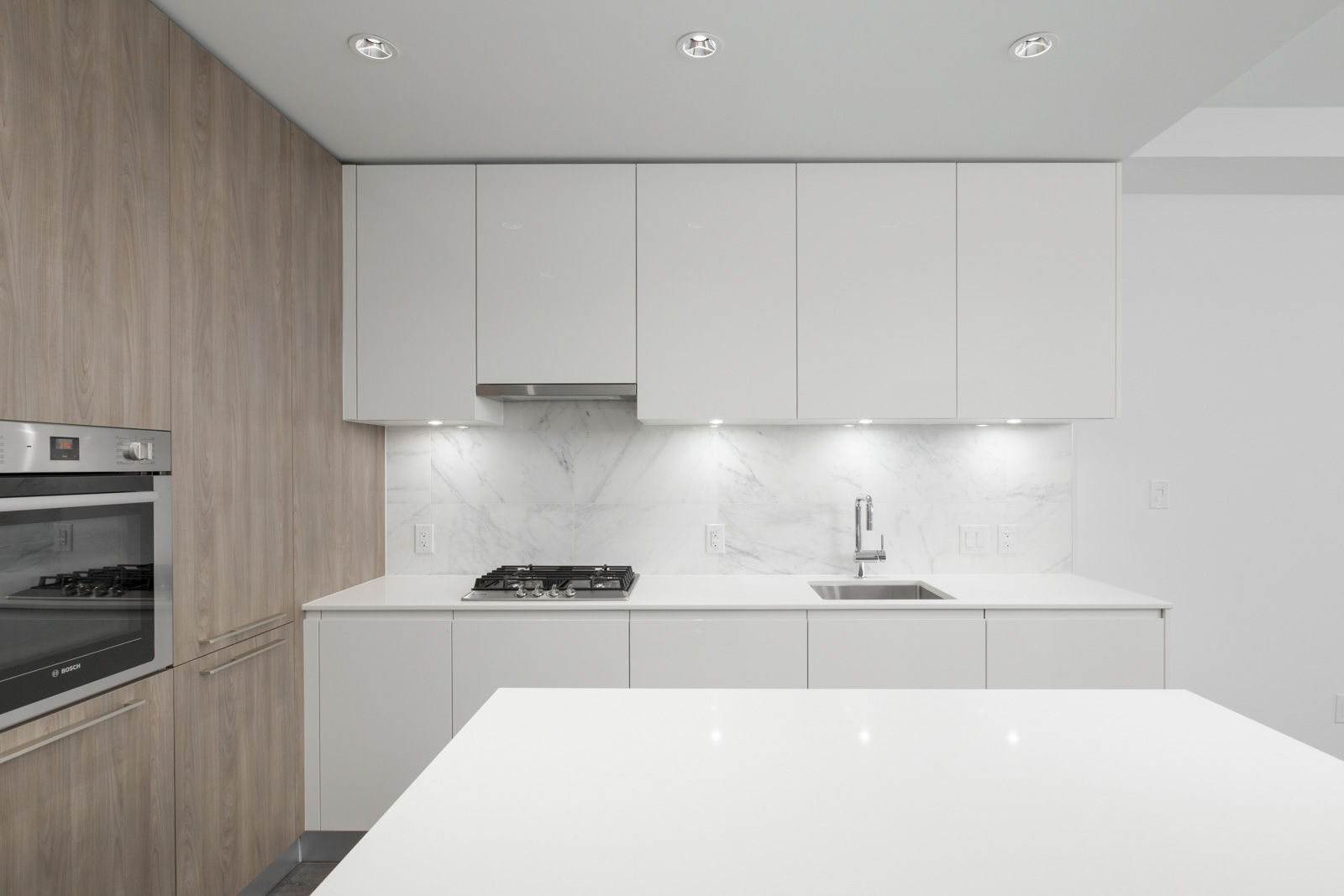 kitchen wall with white cabinets in brand new condo at brentwood tower one of amazing brentwood in burnaby