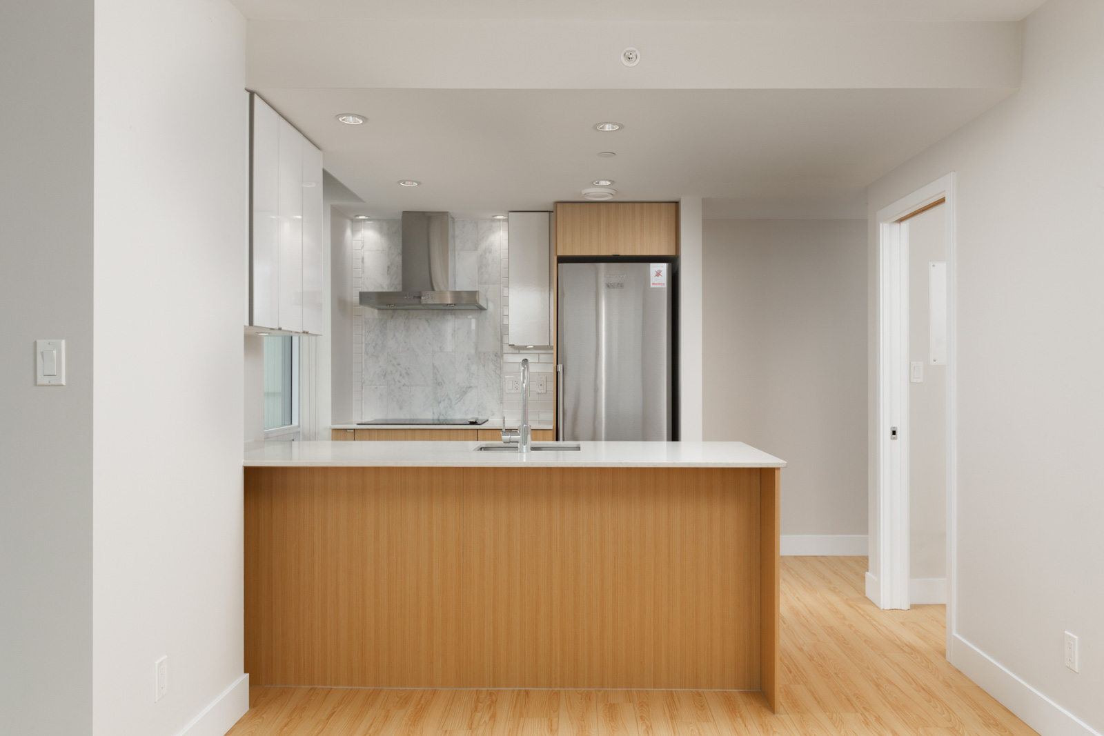 kitchen of rental condo at tower green in false creek olympic village vancouver managed by birds nest properties