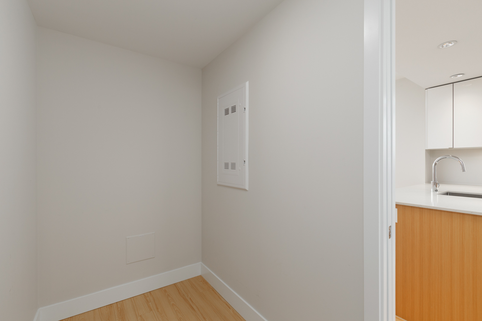 walls of empty bedroom of rental condo at tower green in false creek olympic village vancouver managed by birds nest properties