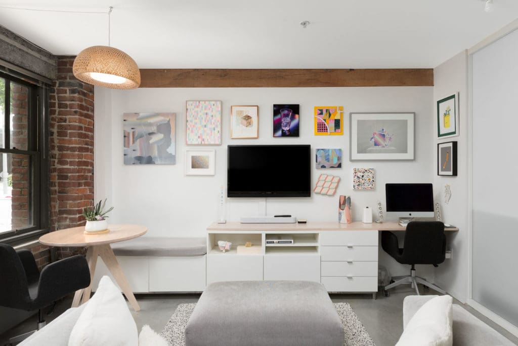 entertainment space in the living area with a workstation on the far right in a rental condo provided by Birds Nest Properties in Vancouver