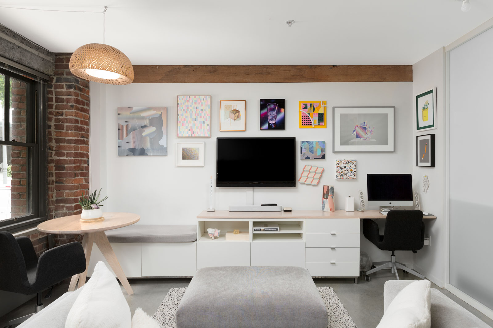 entertainment space in the living area with a workstation on the far right in a rental condo provided by Birds Nest Properties in Vancouver