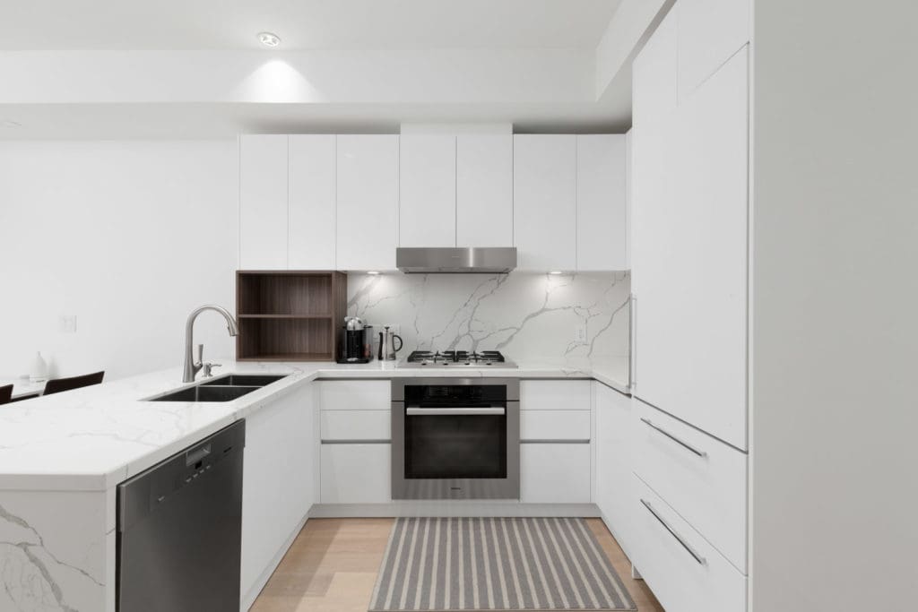 kitchen with appliances of rental condo near commercial drive in east vancouver