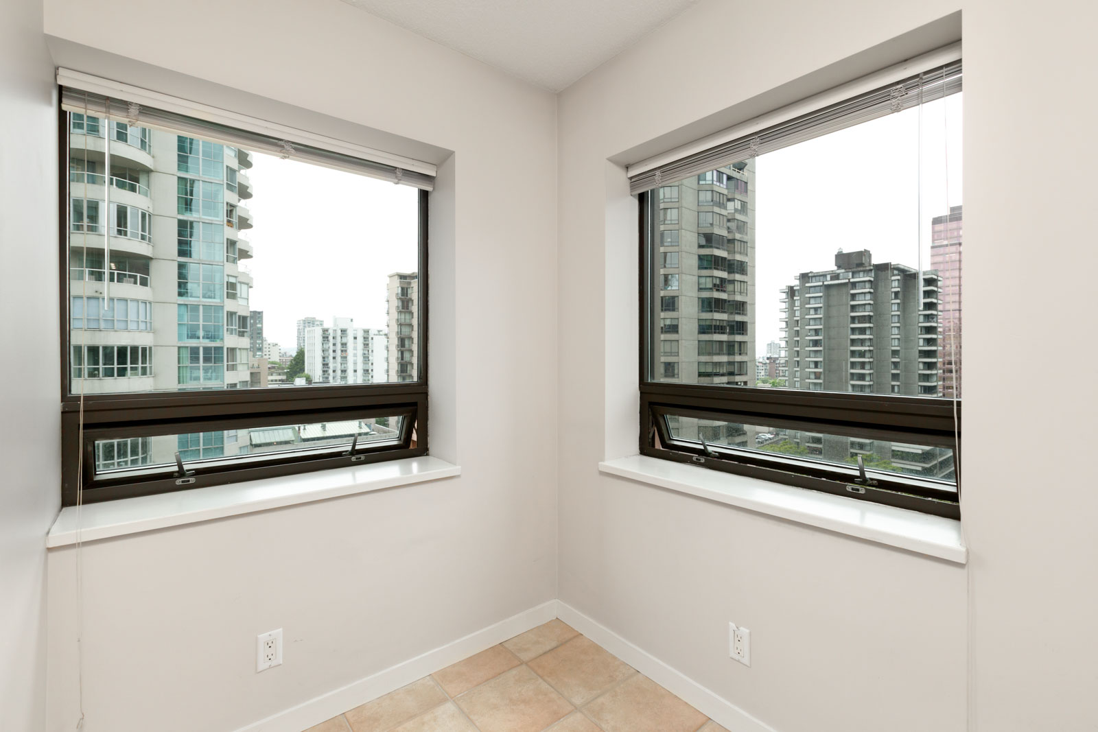 bedroom with white walls and window in rental condo in the Downtown neighbourhood of Vancouver