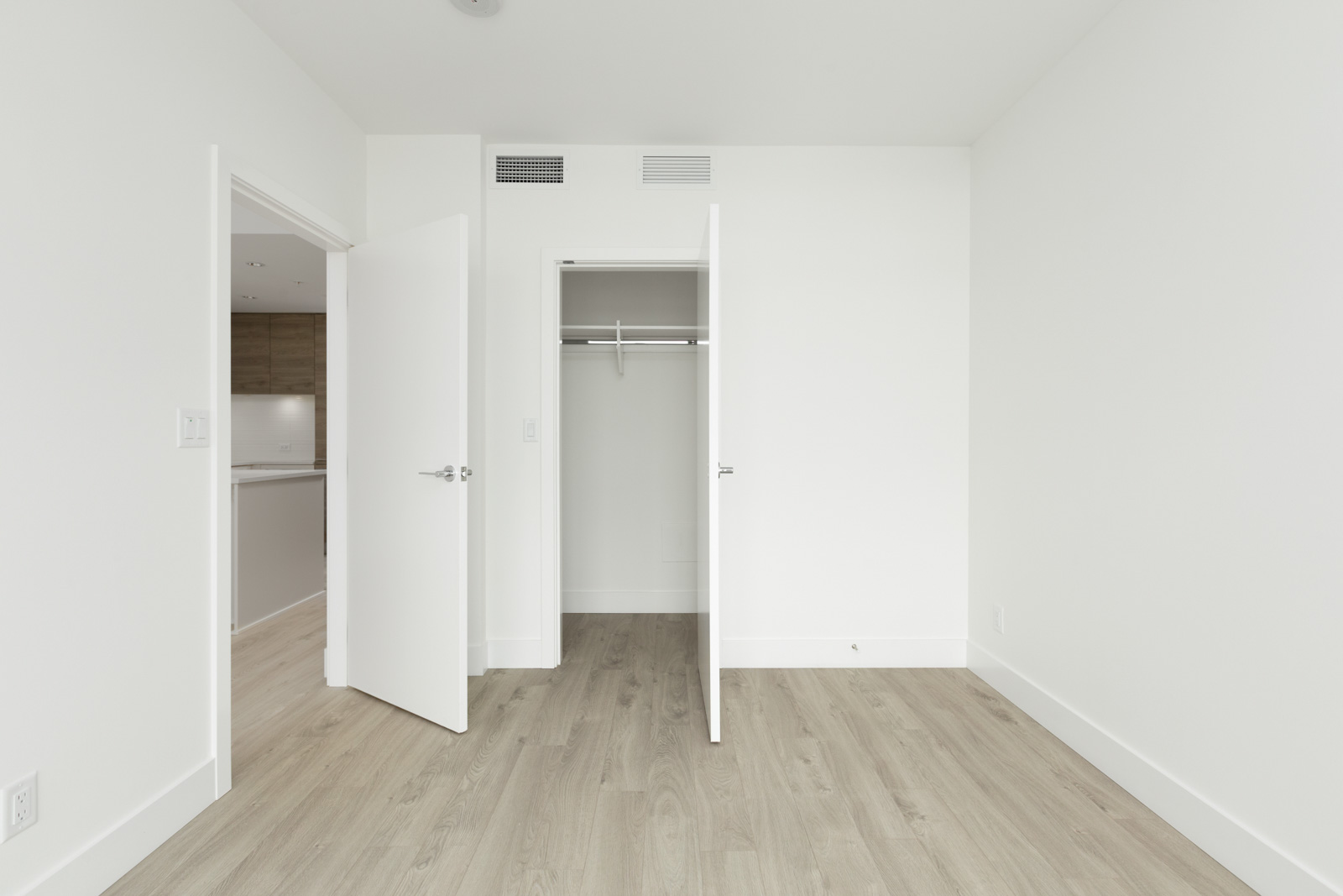 bedroom with white walls and window in rental condo in the Metrotown neighbourhood of Burnaby