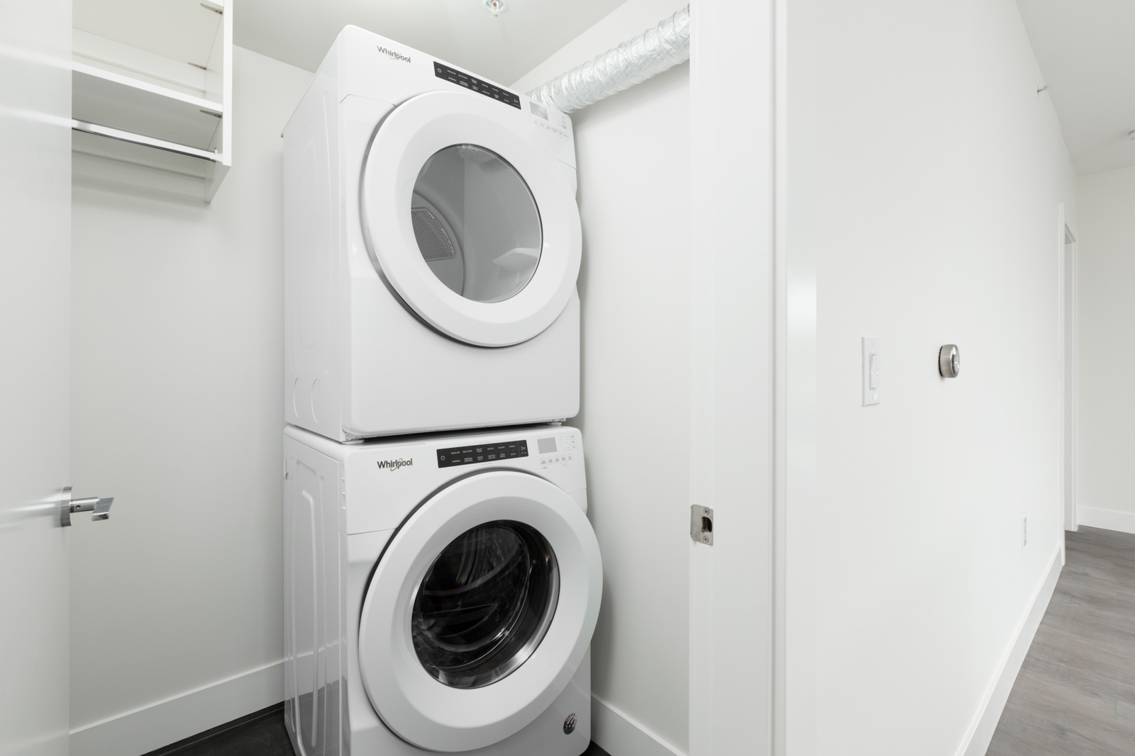 den with white walls and hardwood floors and floor to ceiling windows in rental condo in Vancouver