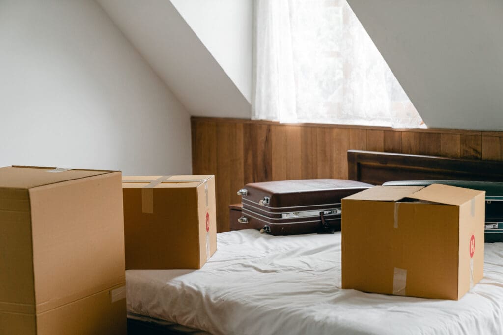 moving boxes on bed in Vancouver condo