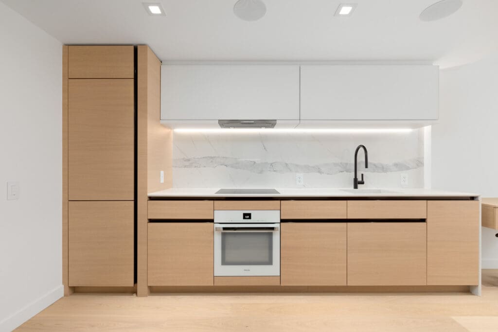 kitchen in brand new cardero building designed by henriquez partners architects in coal harbour in downtown vancouver