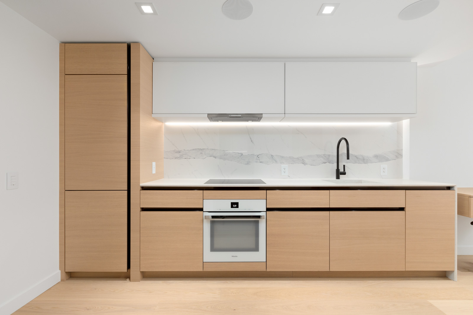 kitchen in brand new cardero building designed by henriquez partners architects in coal harbour in downtown vancouver