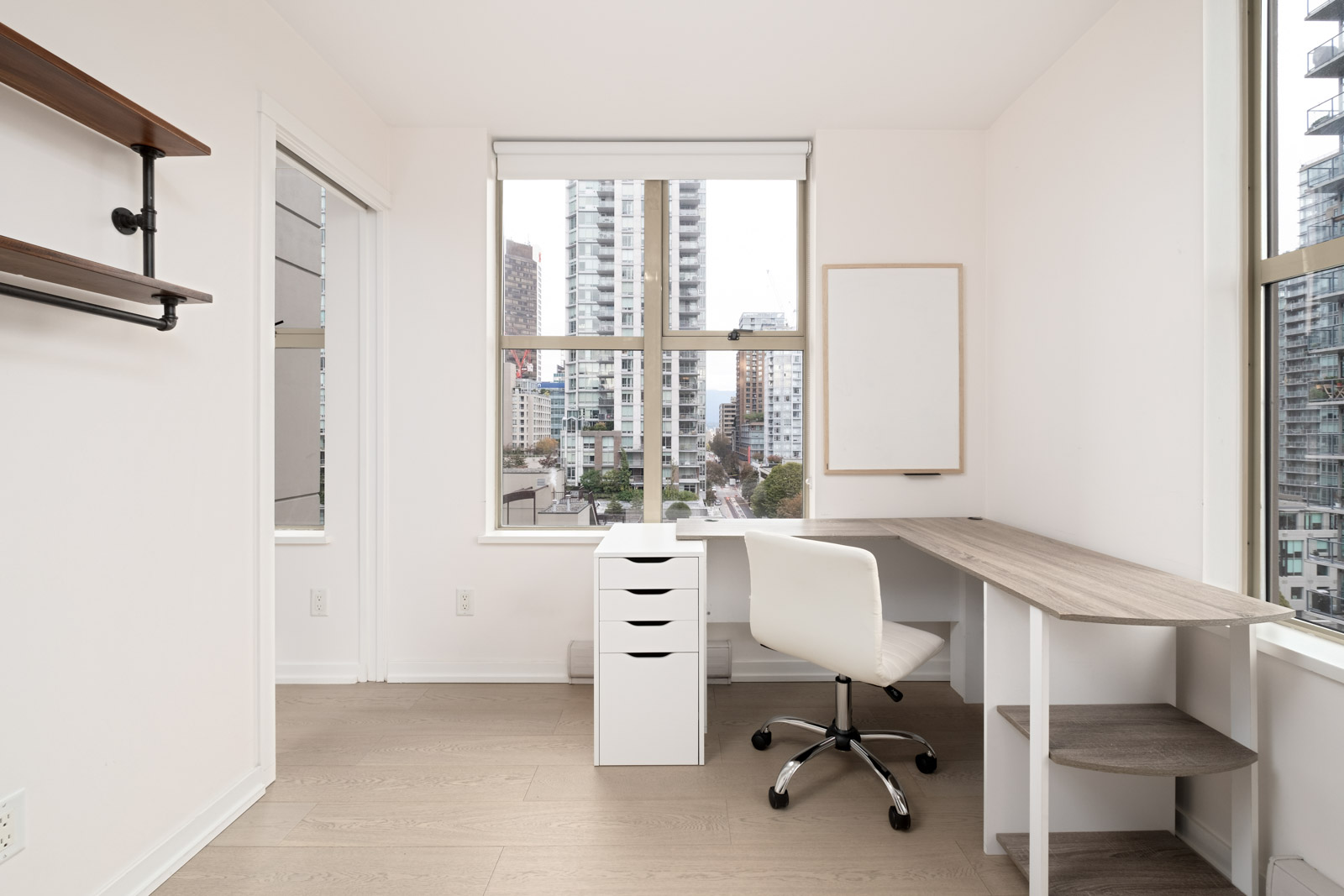 office with window desk and white filing cabinet and hardwood floors in yaletown vancouver furnished rental condo