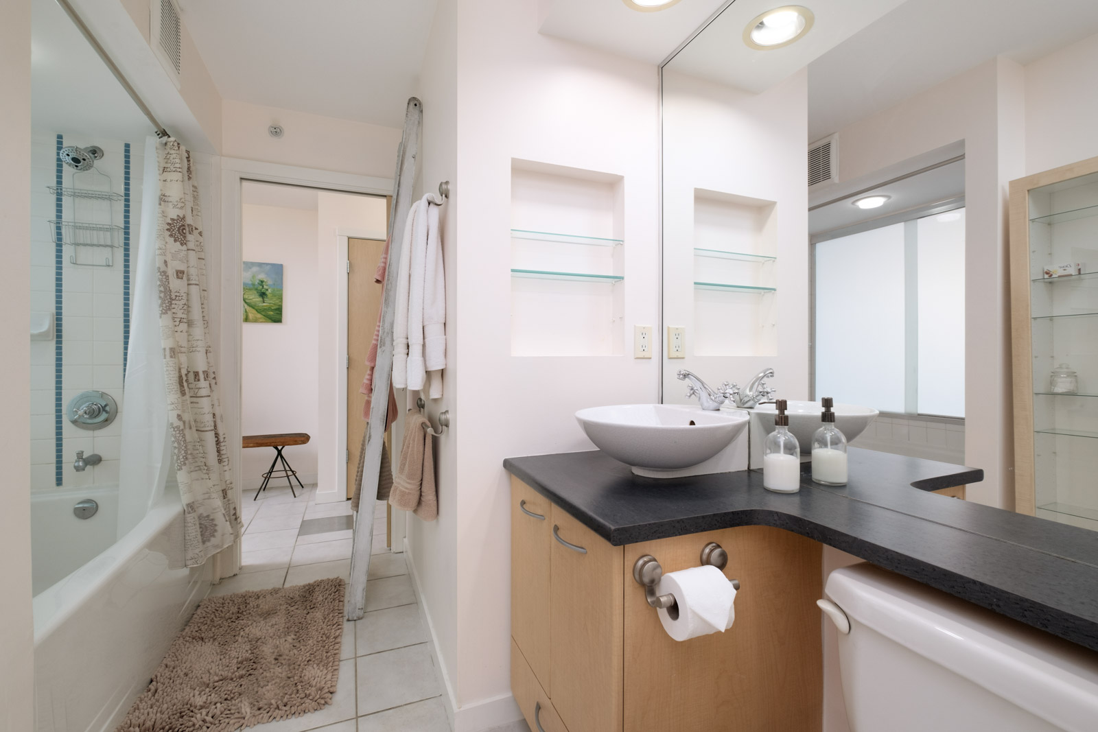 bathroom with tub and vanity in rental condo managed by birds nest properties at mondrian 2 building in yaletown neighbourhood of downtown vancouver