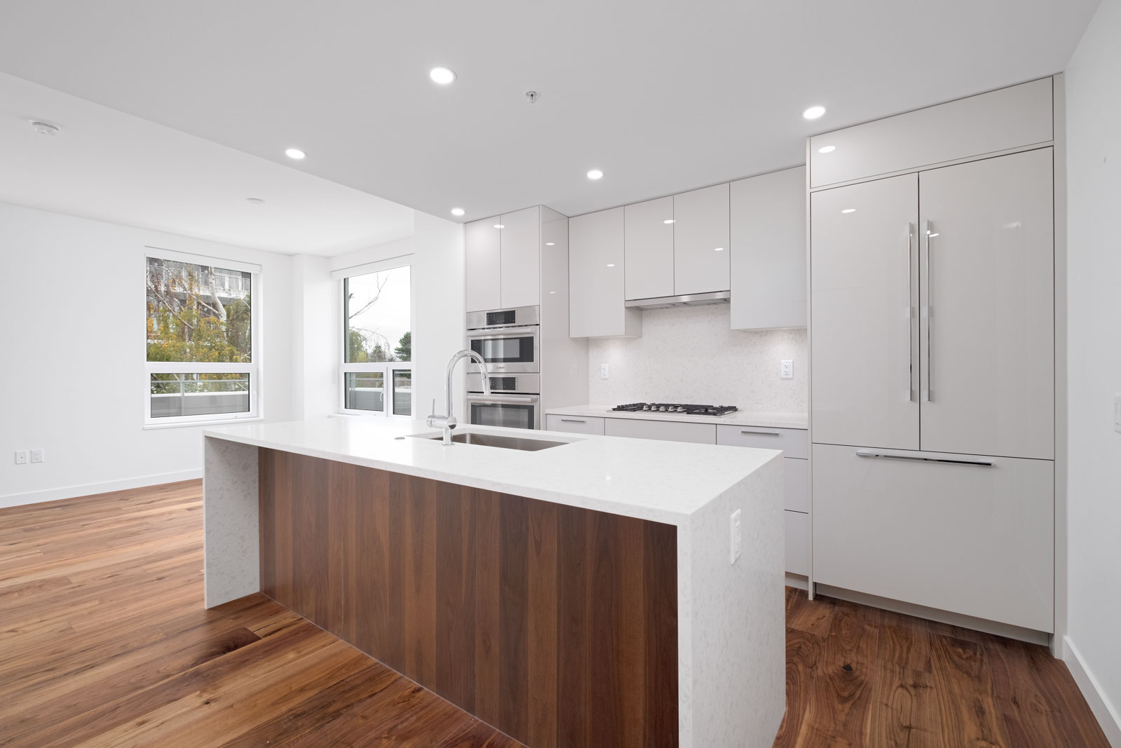 kitchen with island in brand new rental condo of basalt building in vancouver westside