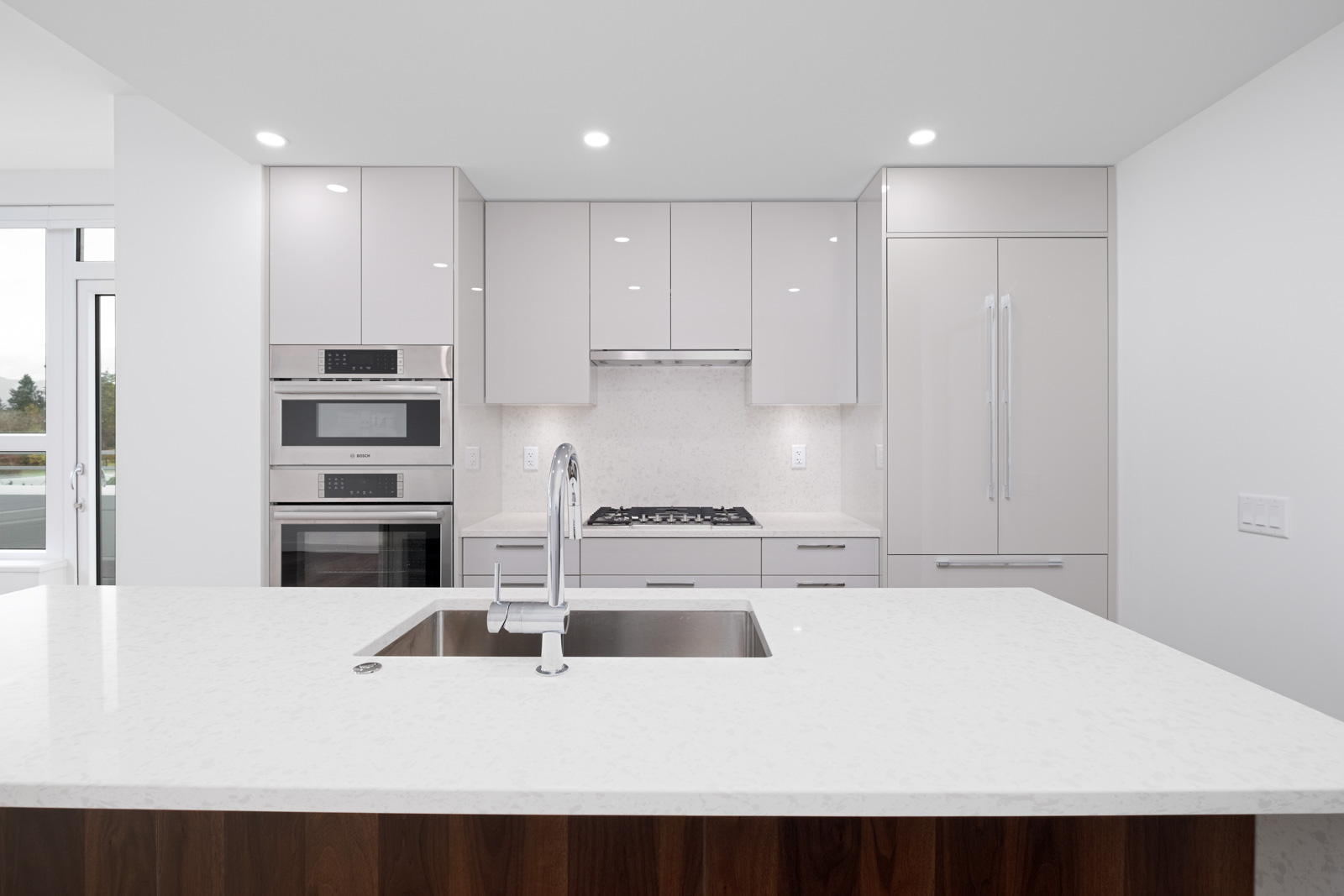 kitchen with quartz countertops in brand new rental condo apartment of basalt developed by pennyfarthing homes in vancouver westside