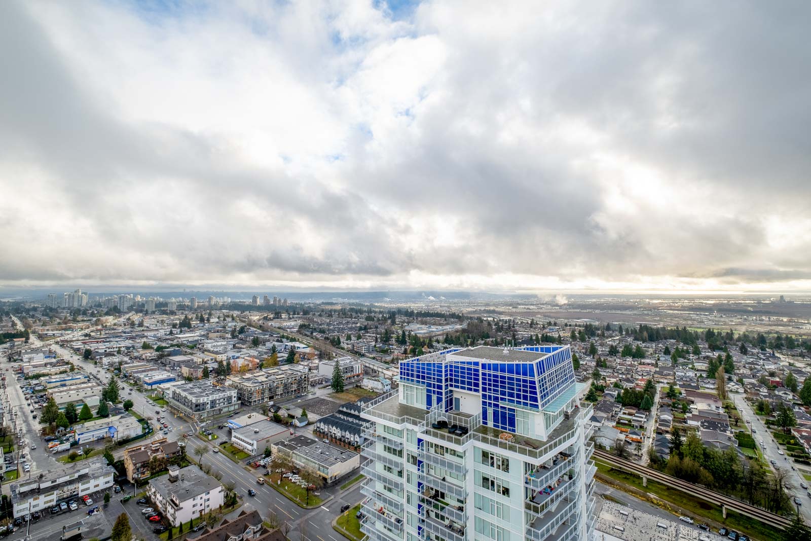 view of buildings and cloudy skies towards mount baker in rental condo in the Metrotown neighbourhood of Burnaby