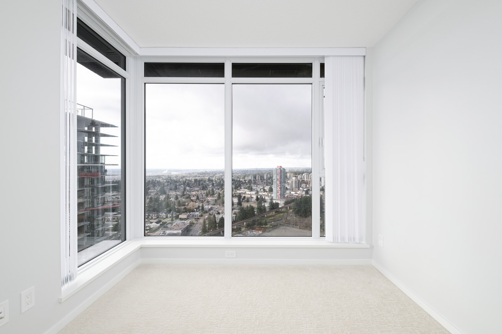 bedroom with white walls and window in rental condo at Vittorio in the Metrotown neighbourhood of Burnaby managed by Birds Nest Properties