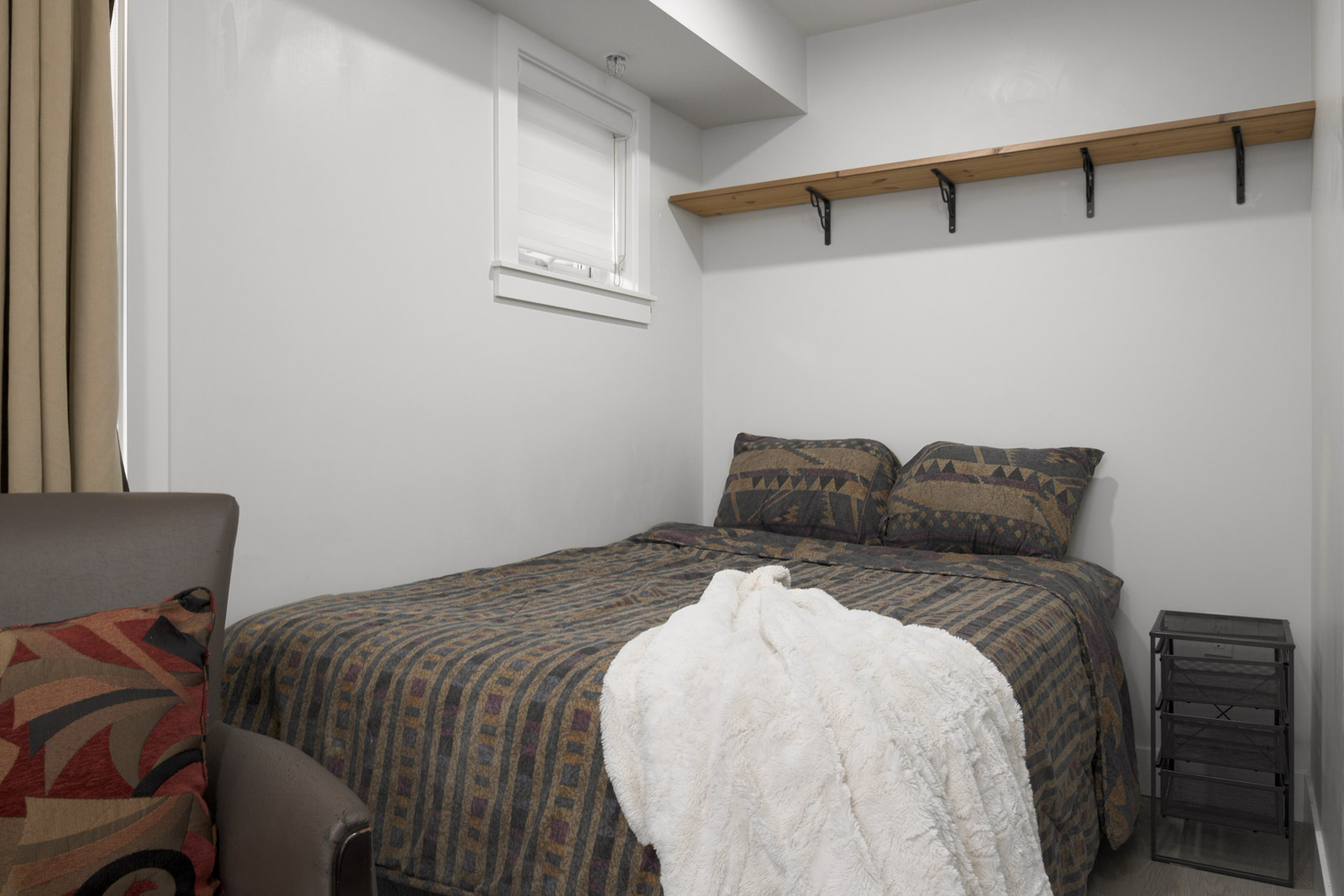 bedroom with white walls in rental house in the norquay east vancouver neighbourhood