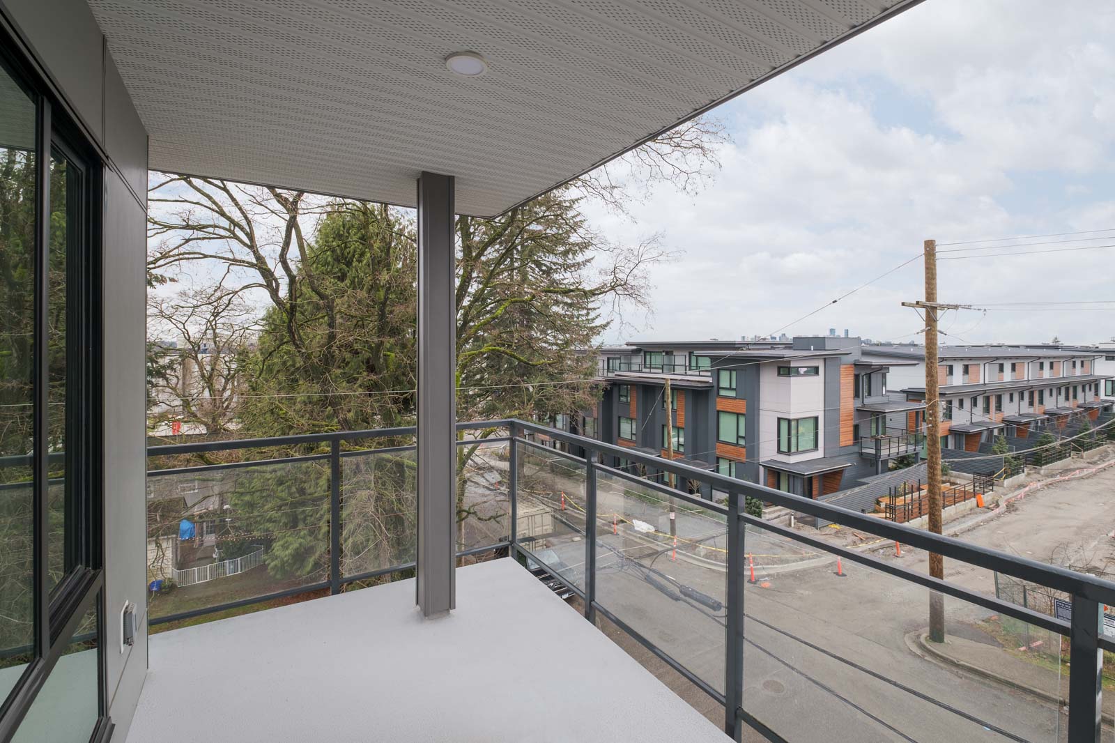 balcony with view of clear skies in rental condo in the Lonsdale neighbourhood of North Vancouver